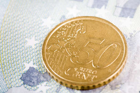 used old European coins, a close-up of metallic money with the disadvantages of paper currencyの写真素材