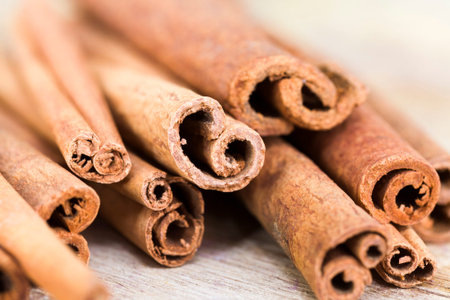 ripe juicy green Apple and fragrant cinnamon on a wooden cutting Board, close-up of food of natural...
