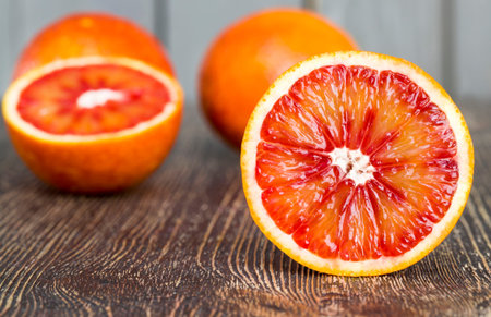 red orange delicious orange fruit, cut into halves during the preparation of desserts