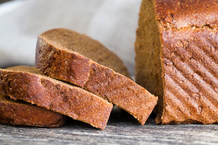 black square loaf of bread made of rye flour