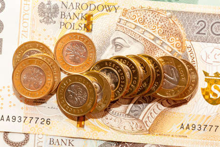 old Polish zloty cash that lies together, the money has stains and external drawbacks from use, close-upの写真素材
