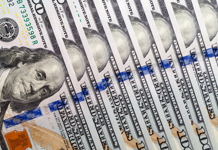 one hundred cash American dollars close-up, genuine cash banknotes
