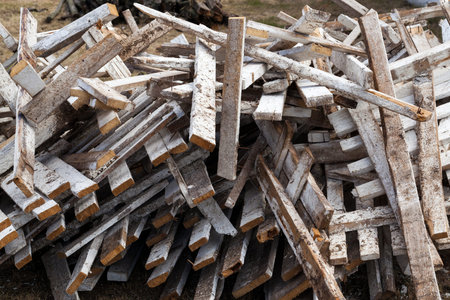 a large number of different boards from crates and corrugated containers in the trash after using...