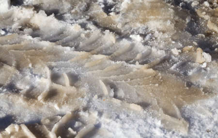 traces of transport passing through snowdrifts in the winter, the Park in the winter after a snow stormの写真素材