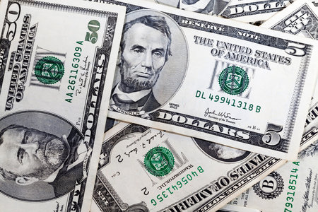 five American dollars in cash, a close-up of real money from American States