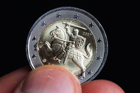 two euros close-up in a man hand