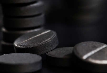 activated carbon in pill form, used in medicine to treat diseases, close-up of medicinesの写真素材