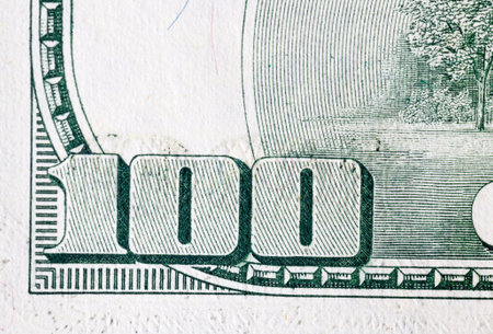 used banknote costs one hundred American dollars, details and features of a banknote close-up