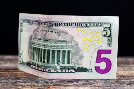five American dollars in cash, a close-up of real money from American States