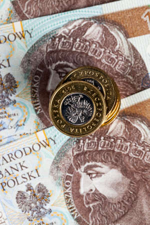 cash and Polish zlotys in coins are on 10 zlotys banknotes, details of the national currency of Polandの写真素材