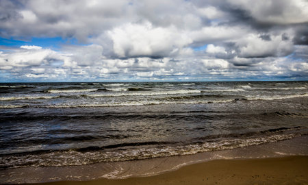 sea with small waves on the surface in the daytime with sunlight and little wind, seascape on the...