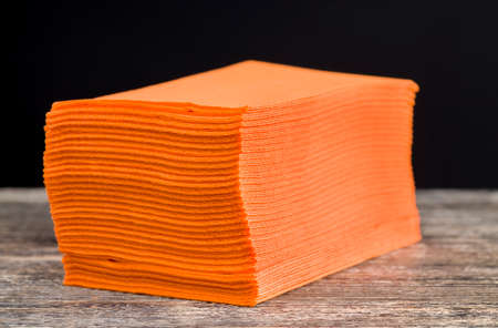 folded together a whole pack of orange paper and cellulose napkins, close-upの写真素材