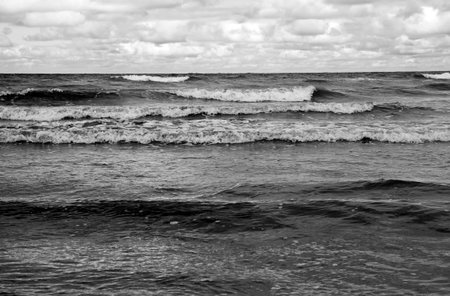 sea waves on the surface of sea water during strong winds and bad weatherの写真素材