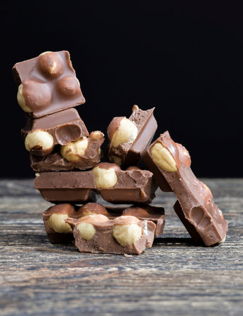 real quality milk chocolate with roasted hazelnut kernel, close-up of cocoa sweets