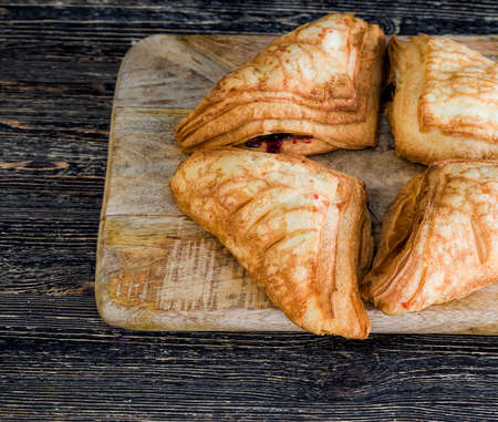 ripe cherry berries as a filling for flour buns, sweet and fresh pastriesの写真素材