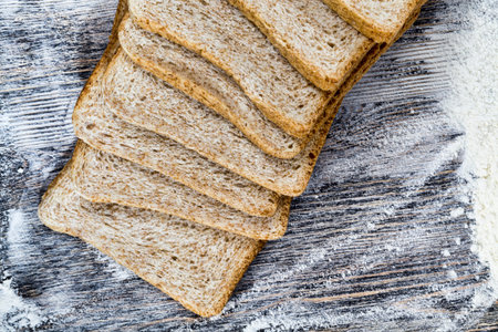sliced fresh bread in white wheat flour, close-up of food