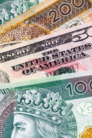 several new banknotes worth one hundred and two hundred Polish zlotys, close-up of cash Polish money togetherの写真素材