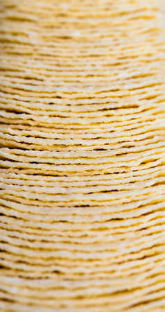 potato chips, close up of chips with a Golden color, harmful high-calorie food, chips are real and crispyの写真素材