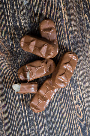 coconut filling in chocolate from cocoa and sugar, high-calorie food, chocolate is sweet and deliciousの写真素材