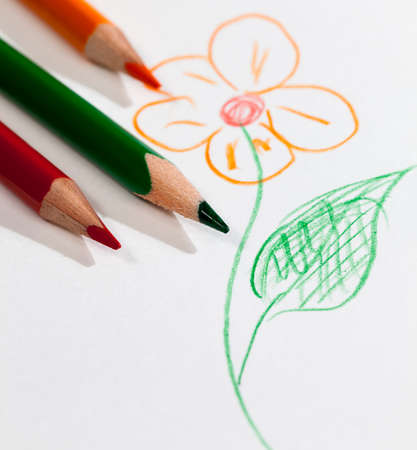 flower drawn with pencils of different colors on poor quality paper, closeup of homemade Amateur drawingの写真素材