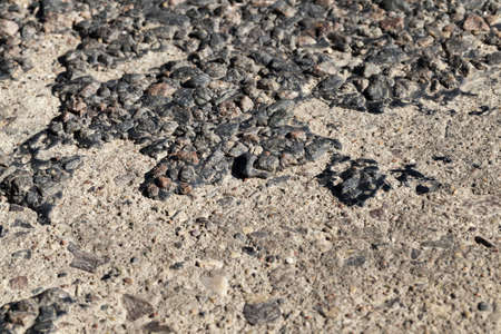 a road made of concrete for traffic and pedestrians, outdated technologies using cement, infrastructure,の写真素材