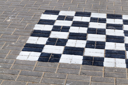 close-up of the road for pedestrians and walkers made of concrete tiles, possible movement of motor...