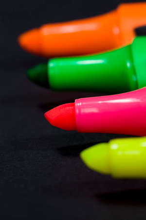multi colored markers made of plastic and dyes, used markers for studying and drawing, closeup of office suppliesの写真素材