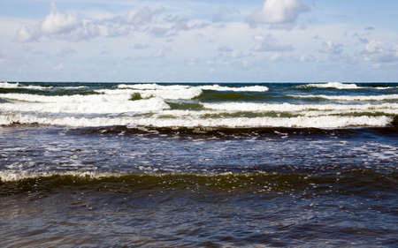 salt water in the sea with waves on the water in the daytime with sunlight, seascape on the Baltic seaの写真素材