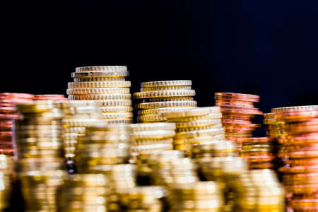 different colors and denominations of coins, metal alloy from which metal cash coins are made for payment and settlement, the course plan of these coins is used in the state monetary system, closeupの写真素材