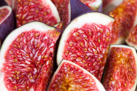 sliced fruit of ripe figs on a cutting board, close-up of figs for cooking