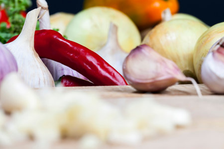 garlic during cooking, kitchen table during cooking food, closeupの写真素材