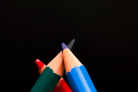 ordinary colored wooden pencil with soft lead of different colors for drawing and creativity, closeup of pencils after sharpening and using, pencil made of natural materials safe for childrenの写真素材