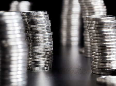 coins with a silvery hue and made of metal alloys, close up of coins is used as a legal means of payment, coins have defects after their useの写真素材