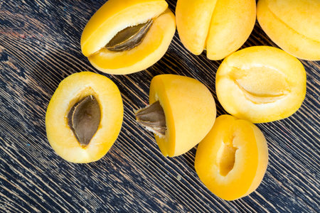 natural ripe and delicious and sliced orange apricots while cooking, lie a group of fresh apricot...
