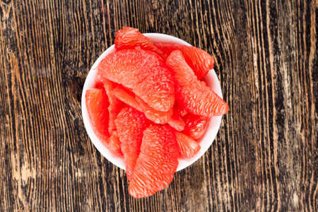 slices of delicious red grapefruit during cooking, red citrus fruits, delicious grapefruit with lots of juiceの写真素材