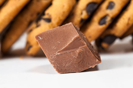 pieces of sweet chocolate together with cookies with pieces of chocolate inside as a filling,...