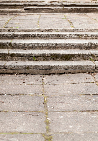 collapsing concrete steps of old city building, path to the top close upの写真素材