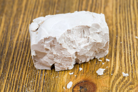 broken portion of real yeast used to make dough for baking, bread, buns and other baking, closeupの写真素材