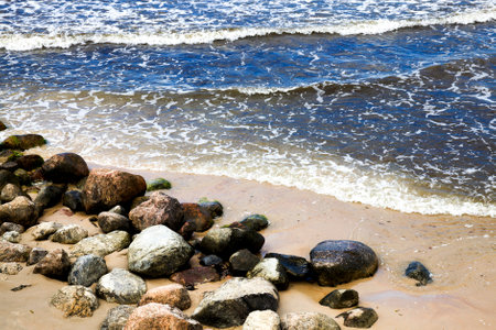 cold windy weather in August, sea coast with lots of waves from windy weather, Baltic sea in summerの写真素材