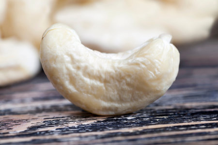 crunchy cashew nuts, delicious and healthy raw cashew nuts, close-up of peeled cashews on the...