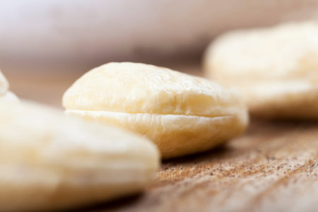 crunchy cashew nuts, delicious and healthy raw cashew nuts, close-up of peeled cashews on the...