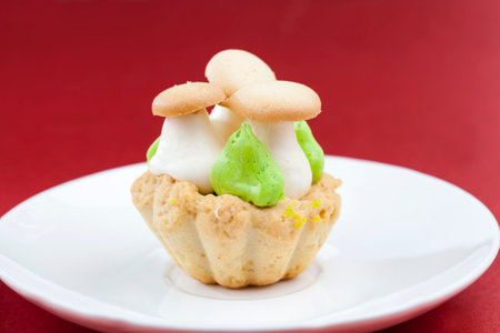 dessert of dough and cream curd cream and shaped decorationsの写真素材