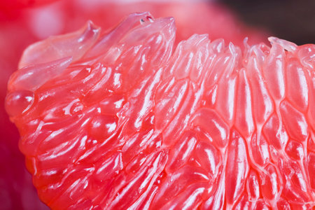 peeled delicious grape pinkfruit ready for food lies on the table, close-upの写真素材