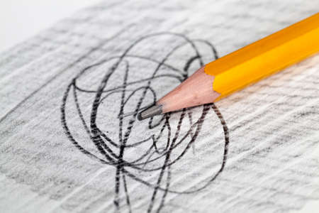 lines of different shapes drawn with pencils of the same color on poor quality paper, closeup of homemade Amateur drawing and pencilの写真素材