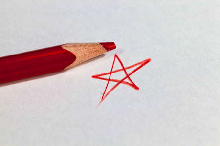 star drawn in red pencil on ordinary paper of poor quality, close-up of homemade Amateur drawingの写真素材
