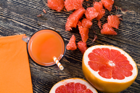 fresh grapefruit juice made at home from juicy red grapefruitsの写真素材