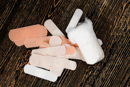 several medical band with treatment for bacteria, a close up of medical items along with cotton for treatmentの写真素材