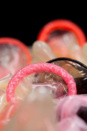 group of latex condoms of different colors, condoms are not in the package, made of natural latex