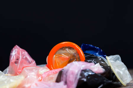 group of latex condoms of different colors, condoms are not in the package, made of natural latexの写真素材