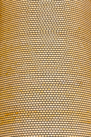 made of modern yellow bricks the wall of a modern building, the wall of bricks painted in yellow during production has an uneven structure, there are different directions and several wallsの写真素材